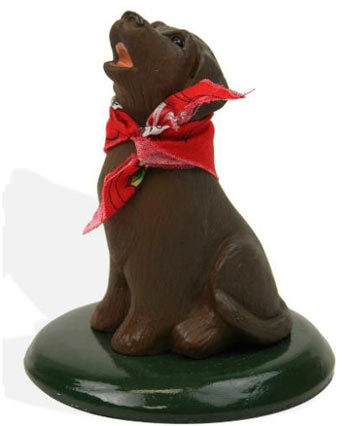 black lab with candy cane figurine
